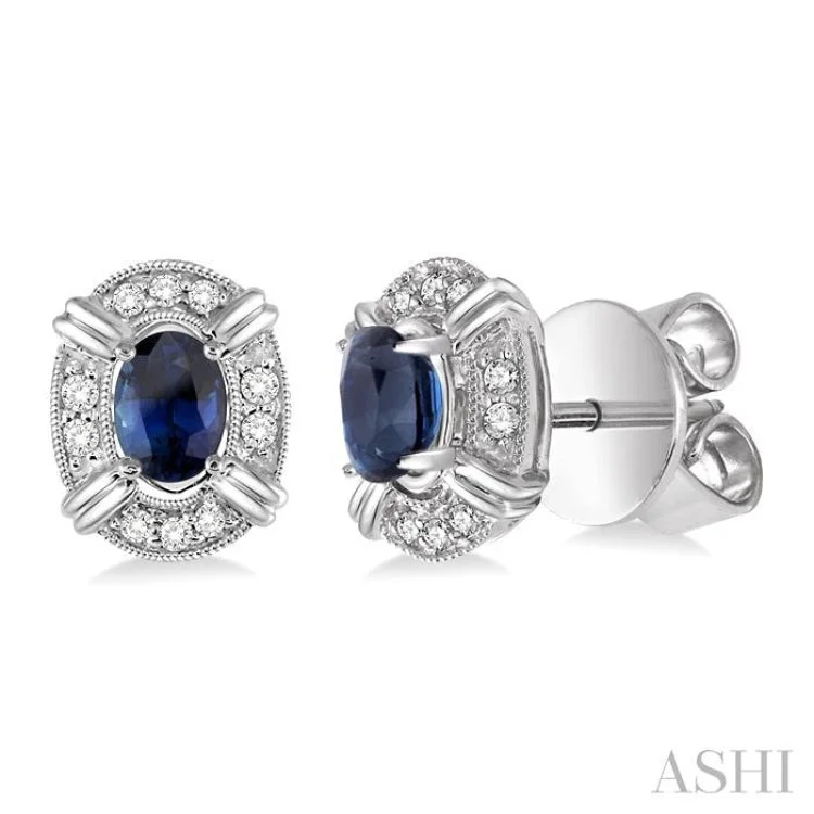 Women’s stud earrings with diamonds-5x3 MM Oval Cut Sapphire and 1/10 Ctw Single Cut Diamond Earrings in 10K White Gold