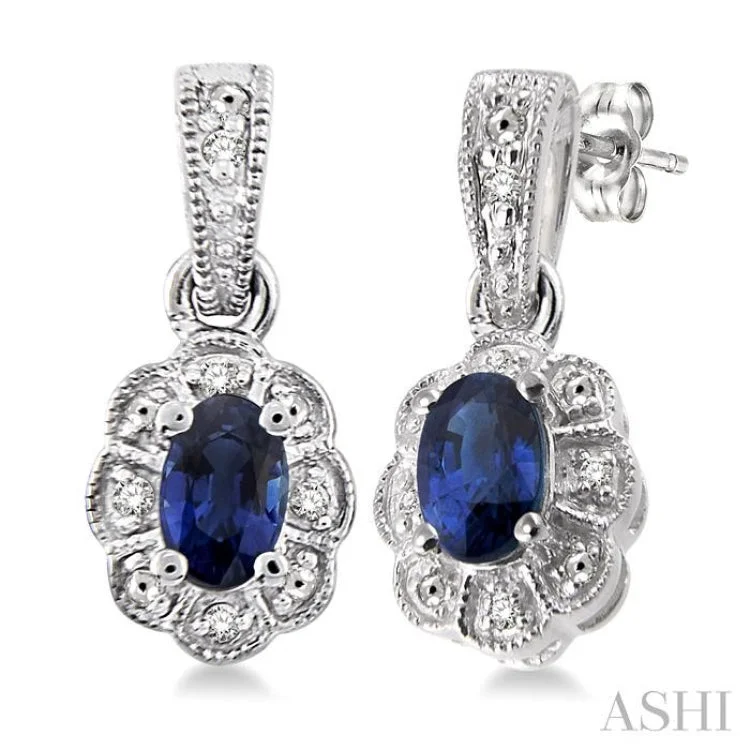 Women’s oval drop earrings-5x3 mm Oval Cut Sapphire and 1/20 ctw Single Cut Diamond Earrings in Sterling Silver