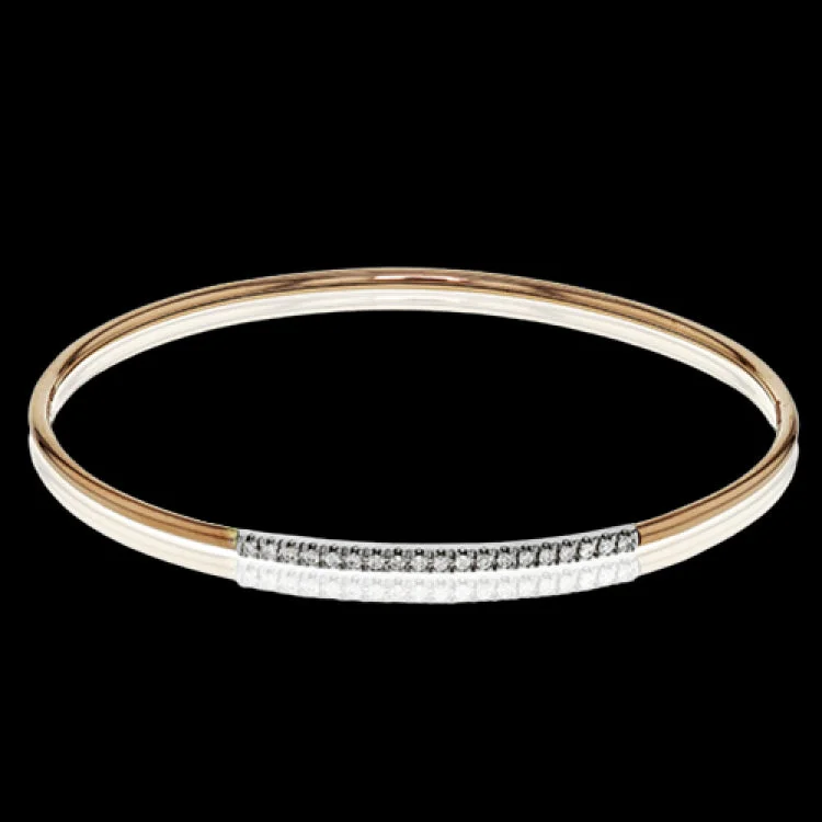 Women’s turquoise bracelets-This lovely 18k rose gold bangle contains .13 ctw of white diamonds in a simple line. This bangle is perfect for stacking, or making a delicate statement all on its own.