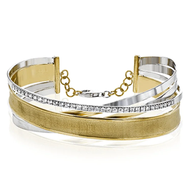 Women’s pearl bracelets-This distinctive two-tone 18k gold bangle features both high shine and brushed finished metals along with .49 ctw of shining diamonds.