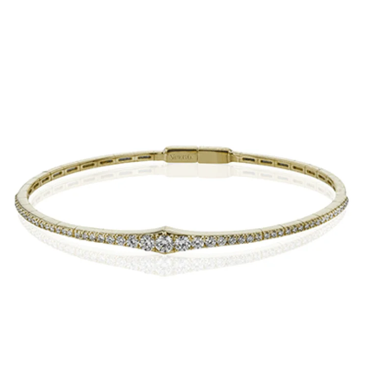 Women’s cuff bracelets-This bangle is a new take on a classic with a slightly tapered design and .88 ctw of white diamonds.