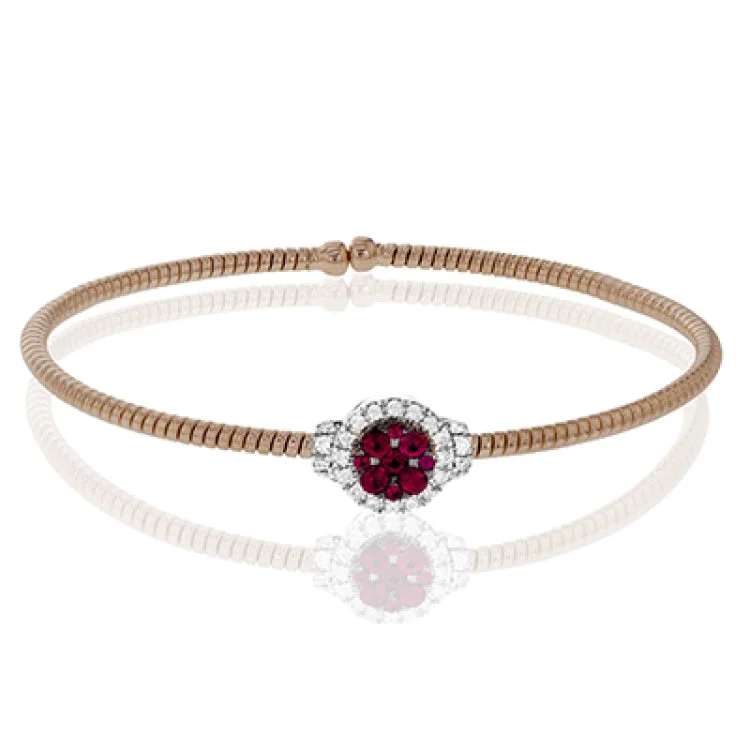 Women’s wrap-around bracelets-This sensational bangle is made from 18k rose and white gold with .27 ctw of white round diamonds encircling .40 ctw of rich red rubies.