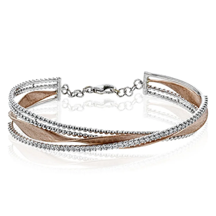 Women’s sterling silver bangles with charms-This eye catching bangle features a ribbon of yellow gold with brushed matte finish, framed with a double line of white gold beading and an asymetric line of diamonds 0.90 ctw.