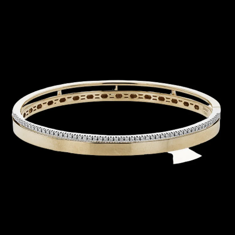 Women’s pearl and silver bracelets-This stunning rose gold bangle has a matte finish and is accented by a row of white diamonds 0.32 ctw., along its edge.