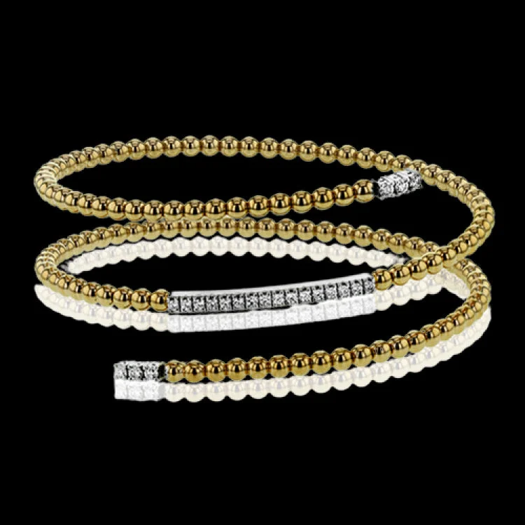 Women’s colorful charm bracelets-This delicate two-tone gold bangle hugs the wrist with its understated .42 ctw of white diamond accents. Perfect for stacking.