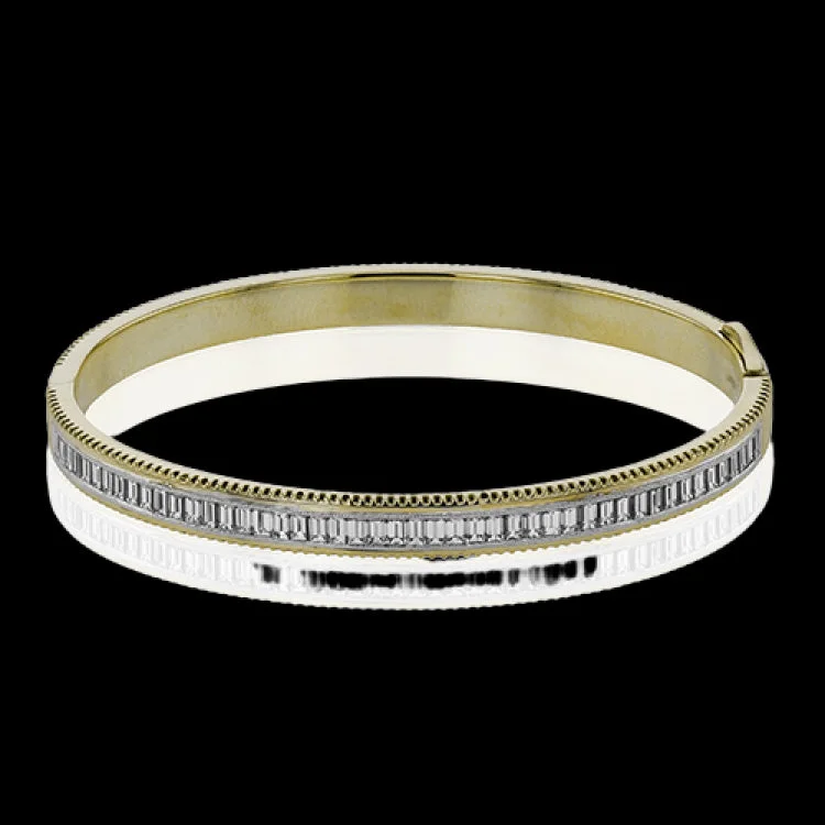 Women’s birthstone bracelets-A striking 18K bangle in two-tone gold with a row of baguette diamonds 2.0 ctw. set in white gold, with a delicate ribbed edge