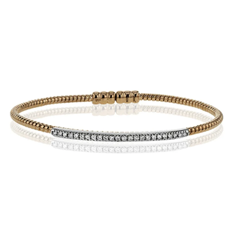 Women’s personalized charm bangles-This 18k white and rose gold bangle is incredibly easy to wear, while providing a complete dose of style with .24 ctw of white diamonds. Perfect for stacking.