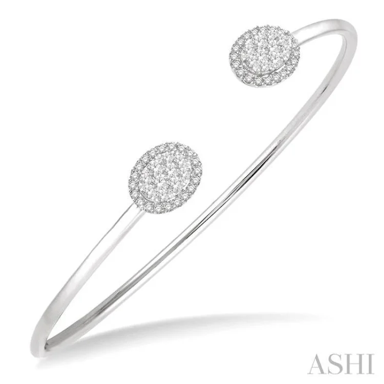 Women’s gemstone bracelets-5/8 Ctw Oval Shape Lovebright Open Cuff Diamond Bangle in 14K White Gold