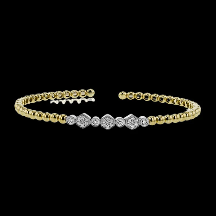 Women’s unique bangles-18K two tone beaded stackable bangle is accented with 0.30 ctw of bezel set white diamonds