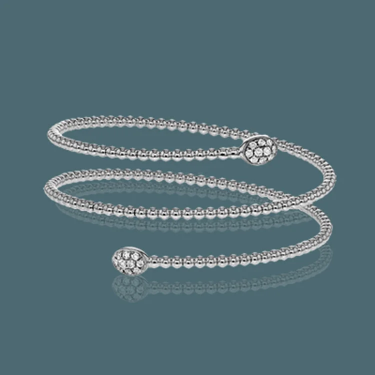 Women’s unique bangles-This triple twist bangle is incredibly comfortable and easy to wear, making it perfect for every occasion. A .30 ctw of white diamonds add the perfect amount of sparkle on either end. Perfect for stacking.