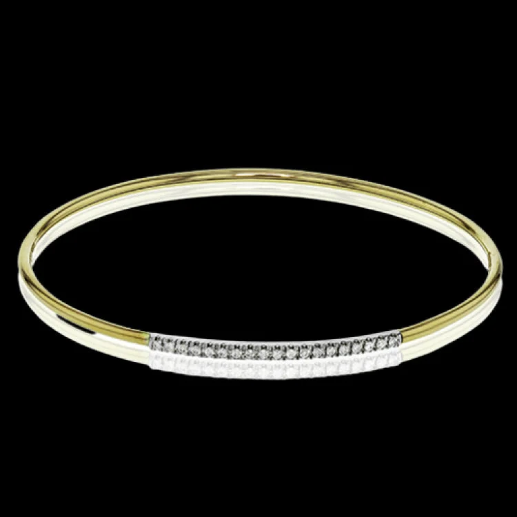 Women’s adjustable gold bracelets-This lovely 18k yellow gold bangle contains .13 ctw of white diamonds in a simple line. This bangle is perfect for stacking, or making a delicate statement all on its own.