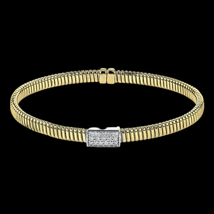 Women’s bangles with charms-18k Yellow gold textured bangle is highlighted by .25 ctw of diamonds set in a rectangular design. Perfect for stacking