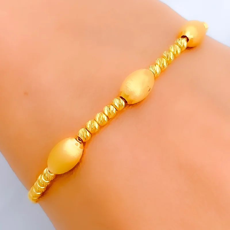 Women’s engraved bangles-Elevated Oval Bead 21k Gold Bolo Bracelet