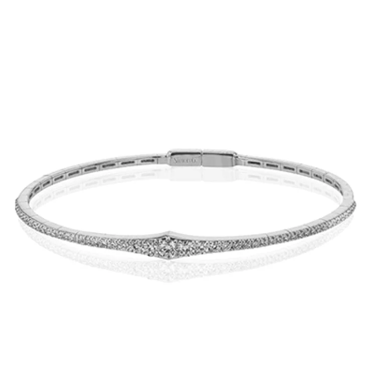 Women’s stackable bracelets-This bangle is a new take on a classic with a slightly tapered design and .88 ctw of white diamonds.