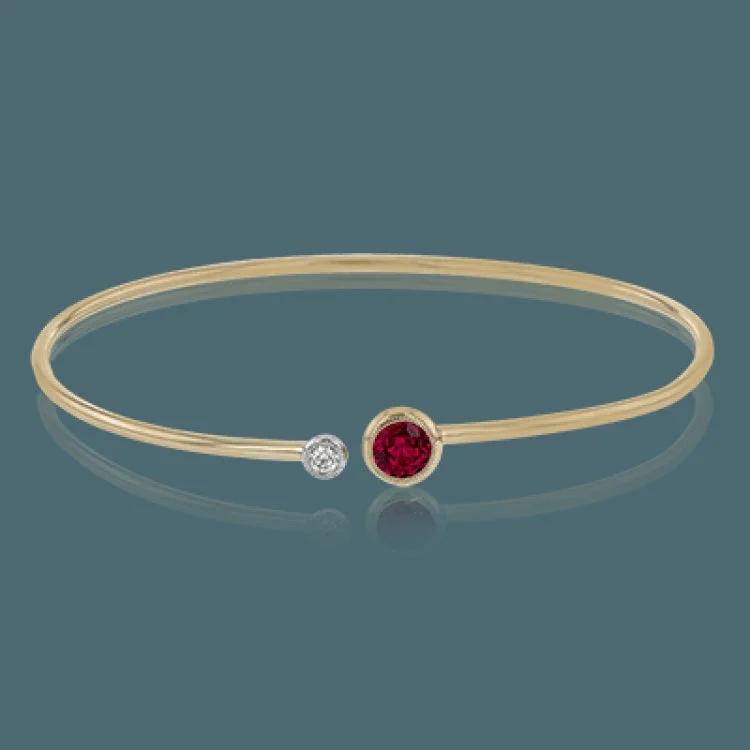 Women’s chic bracelets-This understated rose gold bangle features a subtle .08 ctw white diamond accent opposite a stunning .73 ctw ruby. Perfect for stacking.