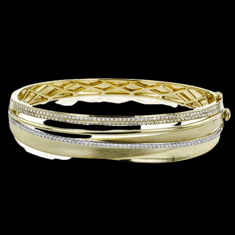 Women’s tennis bracelets-This 18k yellow gold bangle showcases a sophisticated matte surface effect on the gold, accented by several lines of .96 ctw of white diamonds.