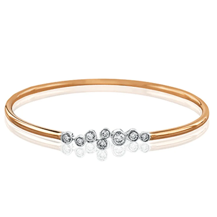 Women’s designer bangles-The clean, minimalist design of this white and rose gold bangle highlights the .57 ctw of round white diamonds sparkling in its centerpiece. Perfect for stacking.