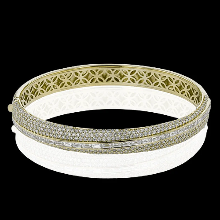 Women’s engraved bracelets-This elegant 18K yellow gold asymmetric bangle features multi rows of pave round diamonds 2.37 ctw., and a row of horizontal baguette diamonds 1.48 ctw.