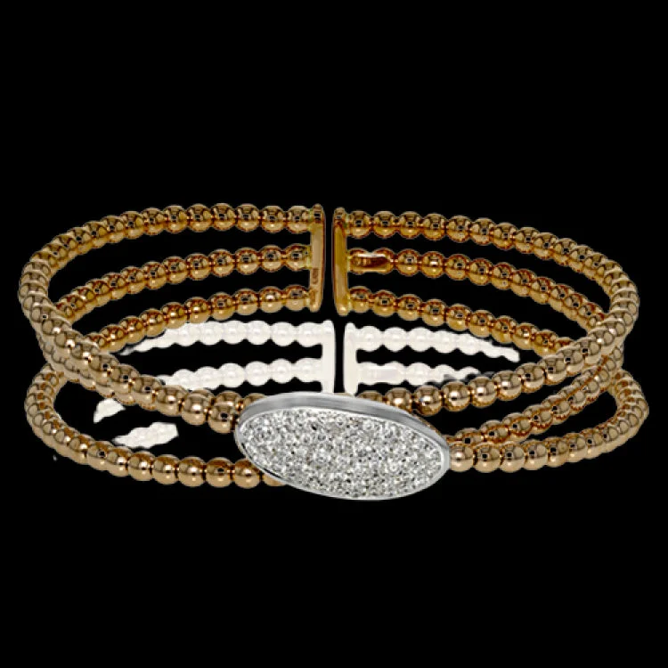 Women’s silver bangles-This modern bangle features and incredibly easy-to-wear design and .70 ctw of shining white diamonds.