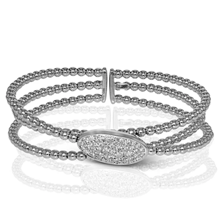 Women’s adjustable bangles-This elegant white gold bangle features a white gold centerpiece set with .70 ctw of white diamonds