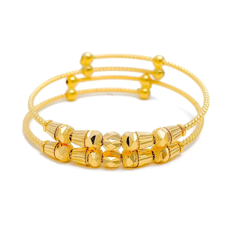 Women’s colorful charm bracelets-Graceful Elongated Orb 22k Gold Baby Bangles