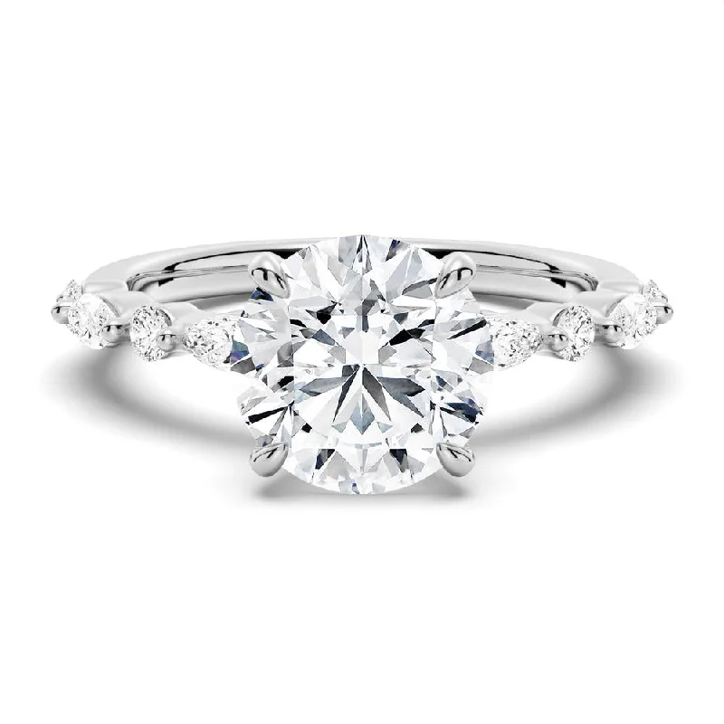 Women’s eco-friendly engagement rings-Unique Round Cut Engagement Ring With Marquise Accents