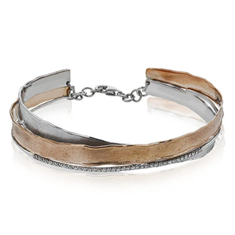 Women’s silver cuff bangles-This two tone rose & white gold bangle is an artistic blend of brushed matte finish with hammered edges, gently twisted together and accented by 0.24 ctw of diamonds.