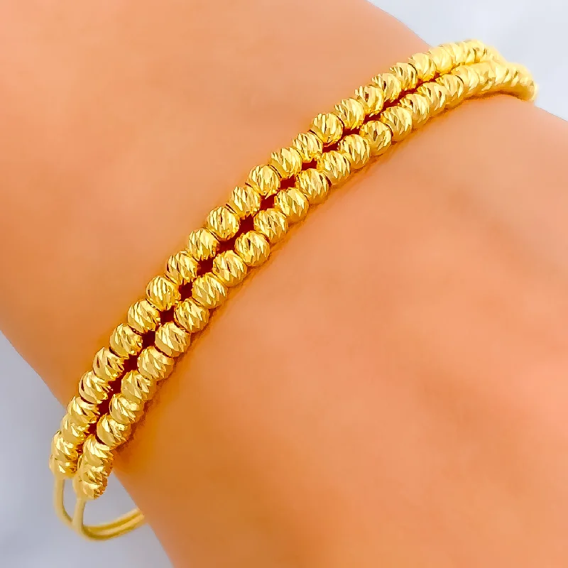 Women’s designer bangles-Shimmering Dual Lined Orb 22k Gold Bangle Bracelet