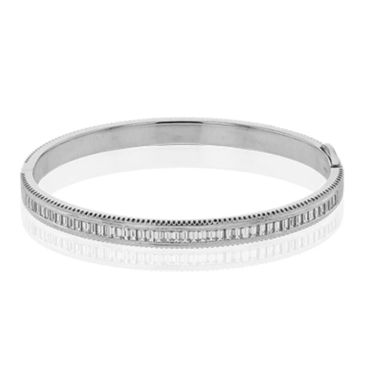 Women’s stackable silver bracelets-A striking 18K bangle in two-tone gold with a row of baguette diamonds 2.0 ctw. set in white gold, with a delicate ribbed edge