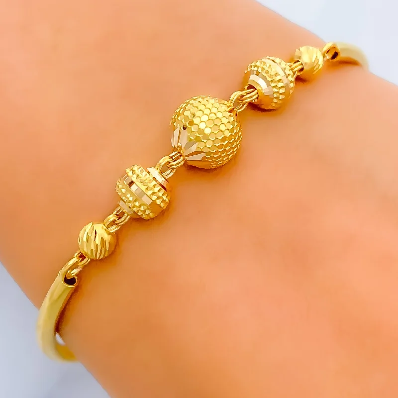 Women’s gemstone charm bracelets-Elegant Palatial 22k Gold Orb Flexi Bangle Bracelet