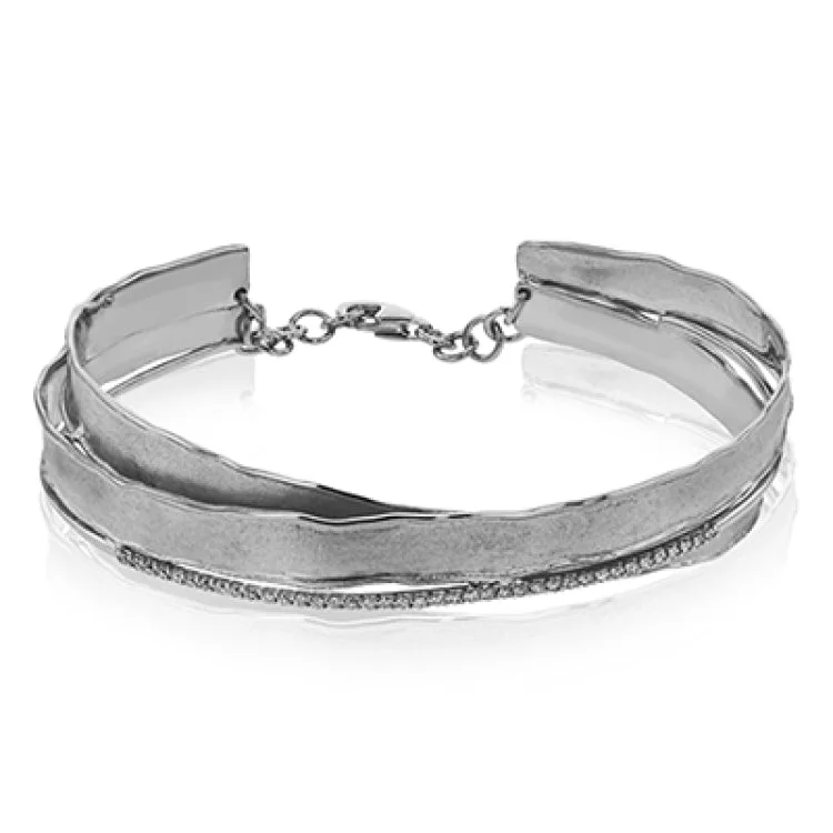 Women’s luxury bangle sets-This two tone rose & white gold bangle is an artistic blend of brushed matte finish with hammered edges, gently twisted together and accented by 0.24 ctw of diamonds.