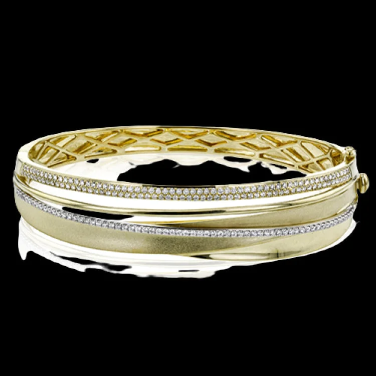 Women’s friendship bracelets-This 18k yellow gold bangle showcases a sophisticated matte surface effect on the gold, accented by several lines of .96 ctw of white diamonds.