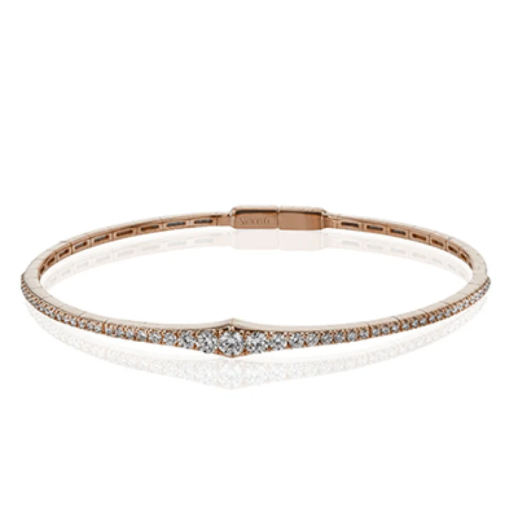 Women’s gemstone bangles-This bangle is a new take on a classic with a slightly tapered design and .88 ctw of white diamonds.