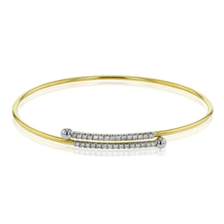 Women’s colorful bangles-This modern 18k gold bangle is has perfect amount of sparkle for everyday with .21 ctw of white diamonds. Perfect for stacking.