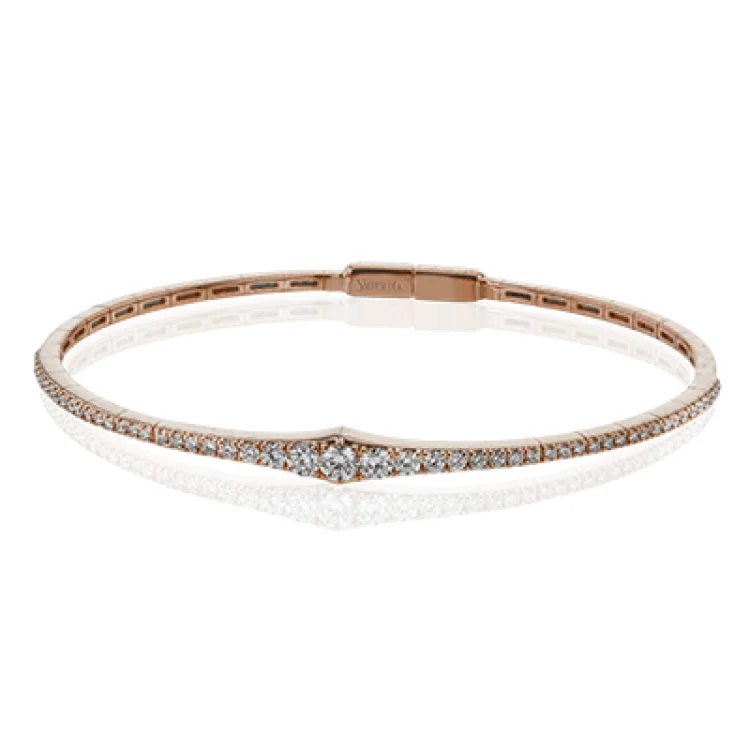 Women’s engraved bracelets-This bangle is a new take on a classic with a slightly tapered design and .88 ctw of white diamonds.