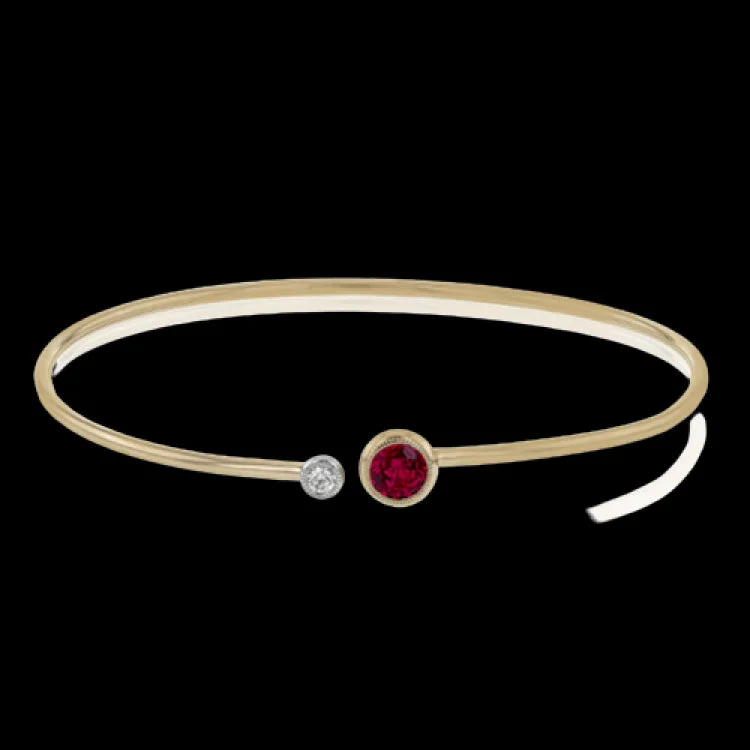 Women’s crystal bangles-This understated rose gold bangle features a subtle .08 ctw white diamond accent opposite a stunning .73 ctw ruby. Perfect for stacking.