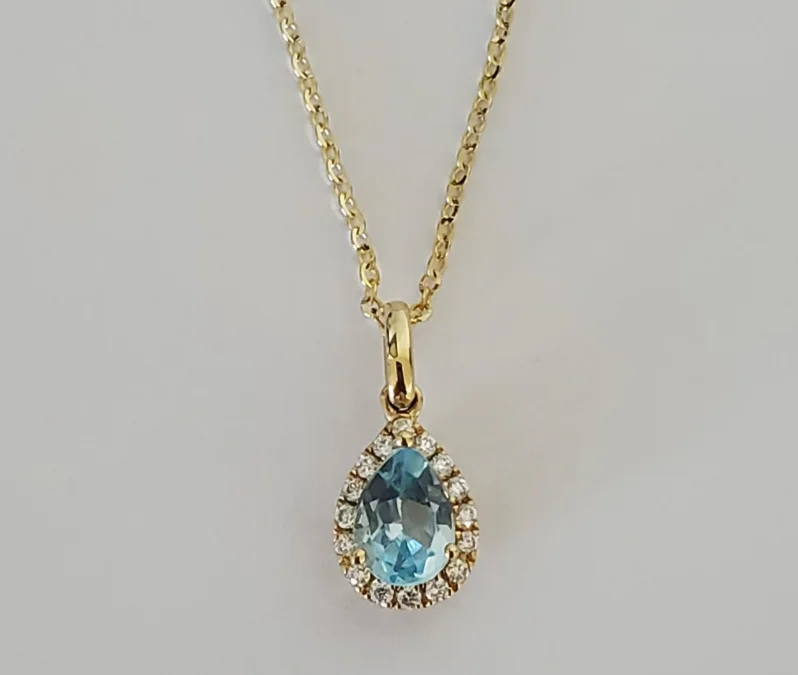 Women’s chunky gold necklaces-14kt Yellow Gold Blue Topaz and Diamond Pendant