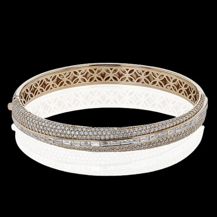 Women’s crystal bracelets-This elegant 18K rose gold asymmetric bangle features multi rows of pave round diamonds 2.37 ctw., and a row of horizontal baguette diamonds 1.48 ctw.